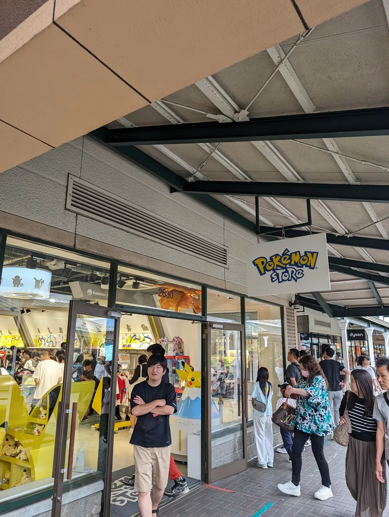 Pokémon store exterior in Japan with colorful signage.