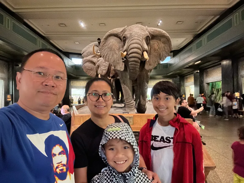 Family at American Museum of Natural History with elephant diorama