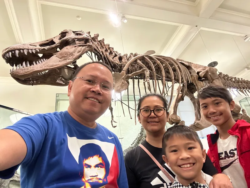 The T-Rex skeleton is massive Family selfie at American Museum of Natural History with T-Rex skeleton