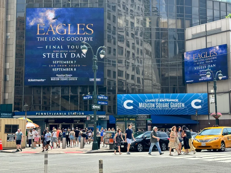 Madison Square Garden and Penn Station right across from our hotel Madison Square Garden and Penn Station exterior with Eagles tour billboard