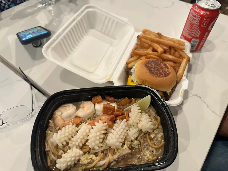Singaporean street food in the middle of Manhattan Singapore Hokkien Mee, burger, fries, and Coke from Urban Hawker
