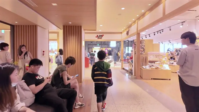 Shopping mall corridor with Jump Shop and people walking at Solamachi in the Tokyo Skytree complex, Tokyo, Japan.