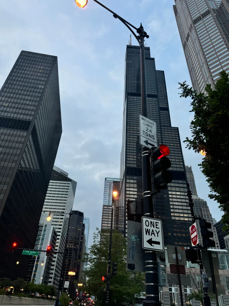Low-angle view of Chicago skyscrapers including Willis Tower under a cloudy sky, Chicago, Illinois