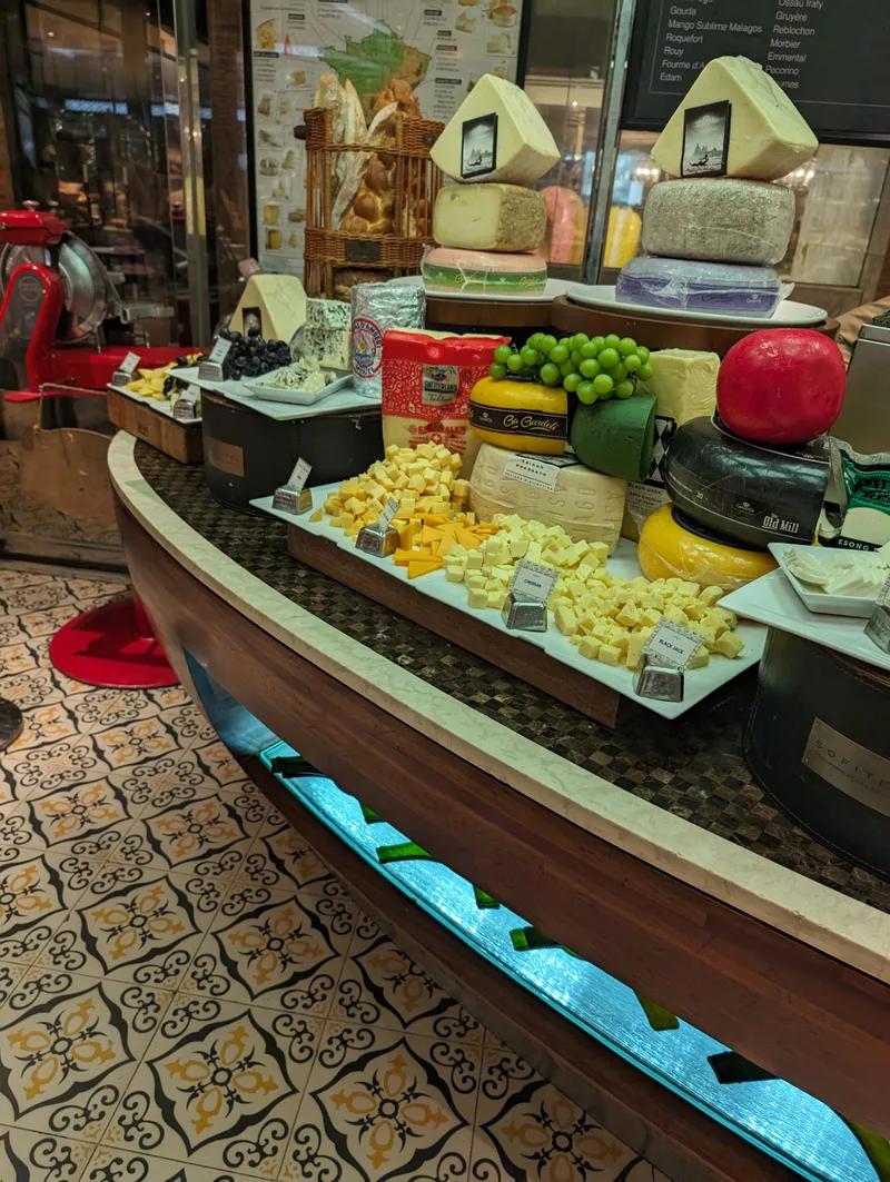 Elaborate cheese display with various cheeses, grapes, and crackers at the Spiral buffet, Sofitel Philippine Plaza, Manila.